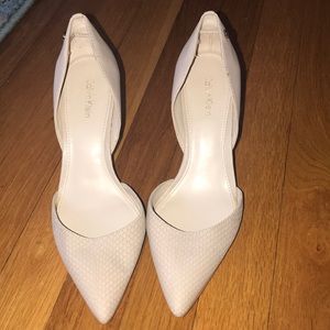 Calvin Klein  nude snake skin pumps.